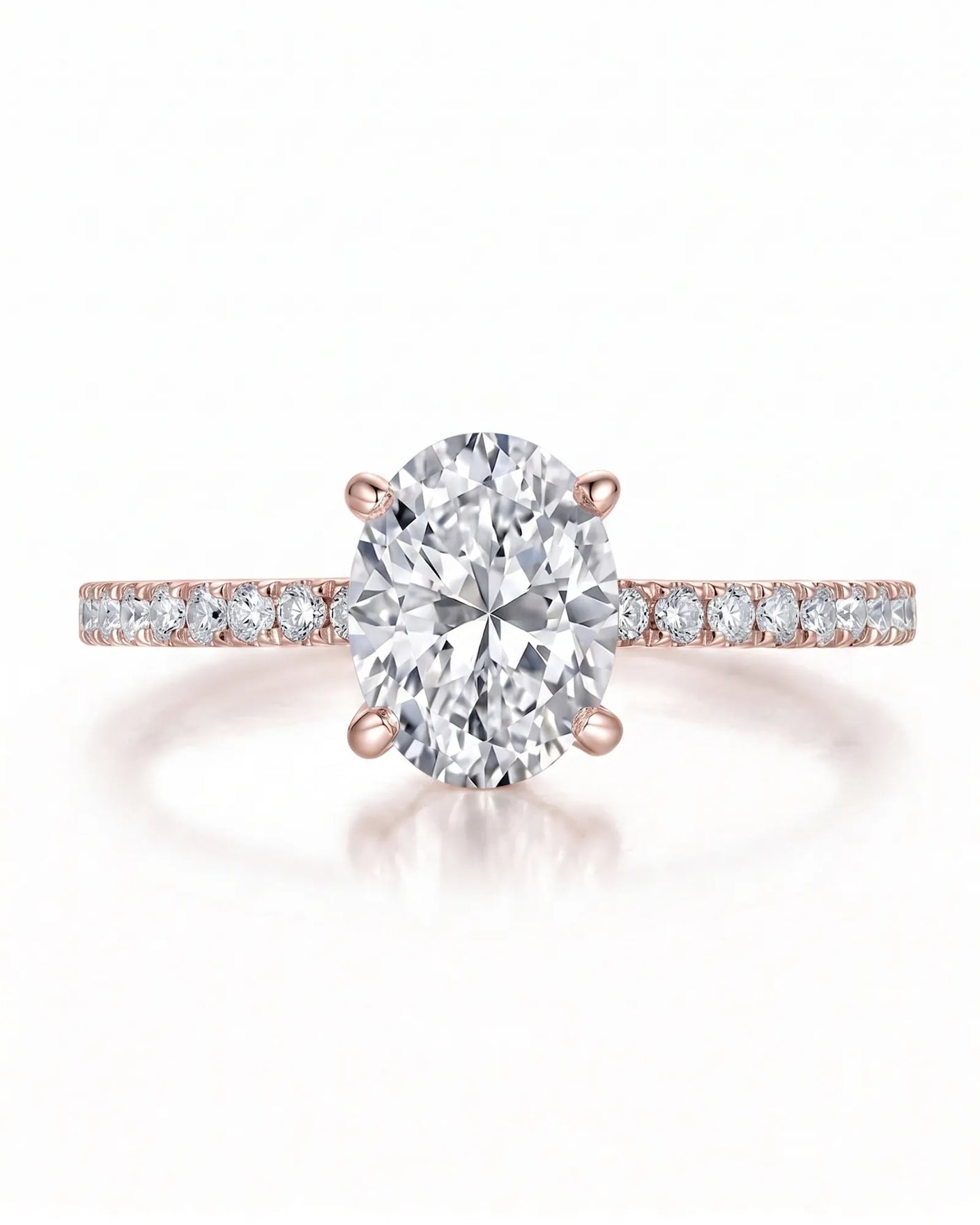 Adriana 1 carat F-colour oval natural diamond hidden halo ring in 18K rose gold, front view of oval centre and pavé shoulders | SARATTI