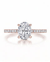Adriana 1 carat F-colour oval natural diamond hidden halo ring in 18K rose gold, front view of oval centre and pavé shoulders | SARATTI