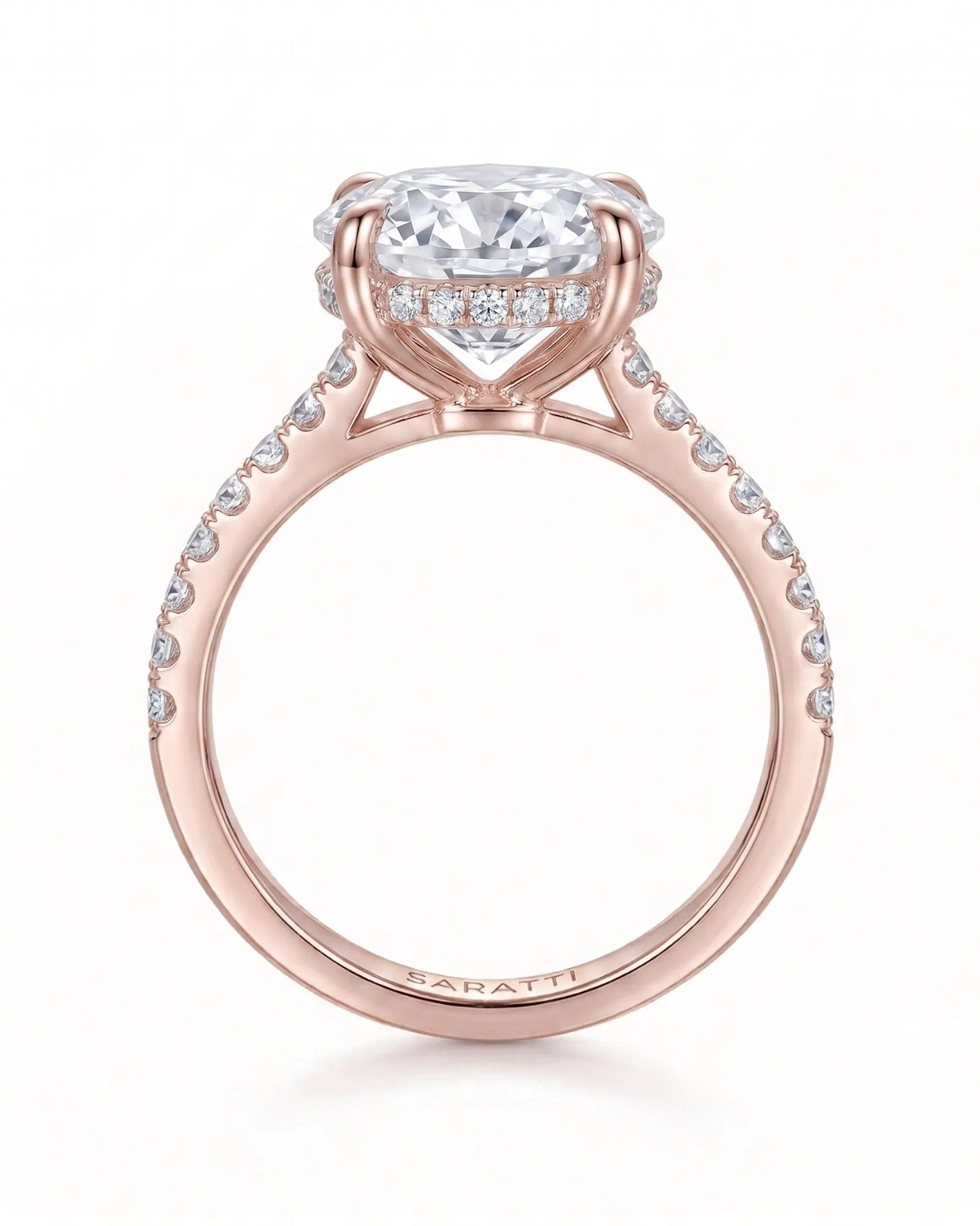 Adriana 1 carat F-colour oval natural diamond hidden halo ring in 18K rose gold, side profile showing hidden halo and raised gallery | SARATTI