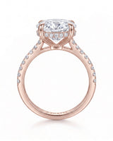 Adriana 1 carat F-colour oval natural diamond hidden halo ring in 18K rose gold, side profile showing hidden halo and raised gallery | SARATTI