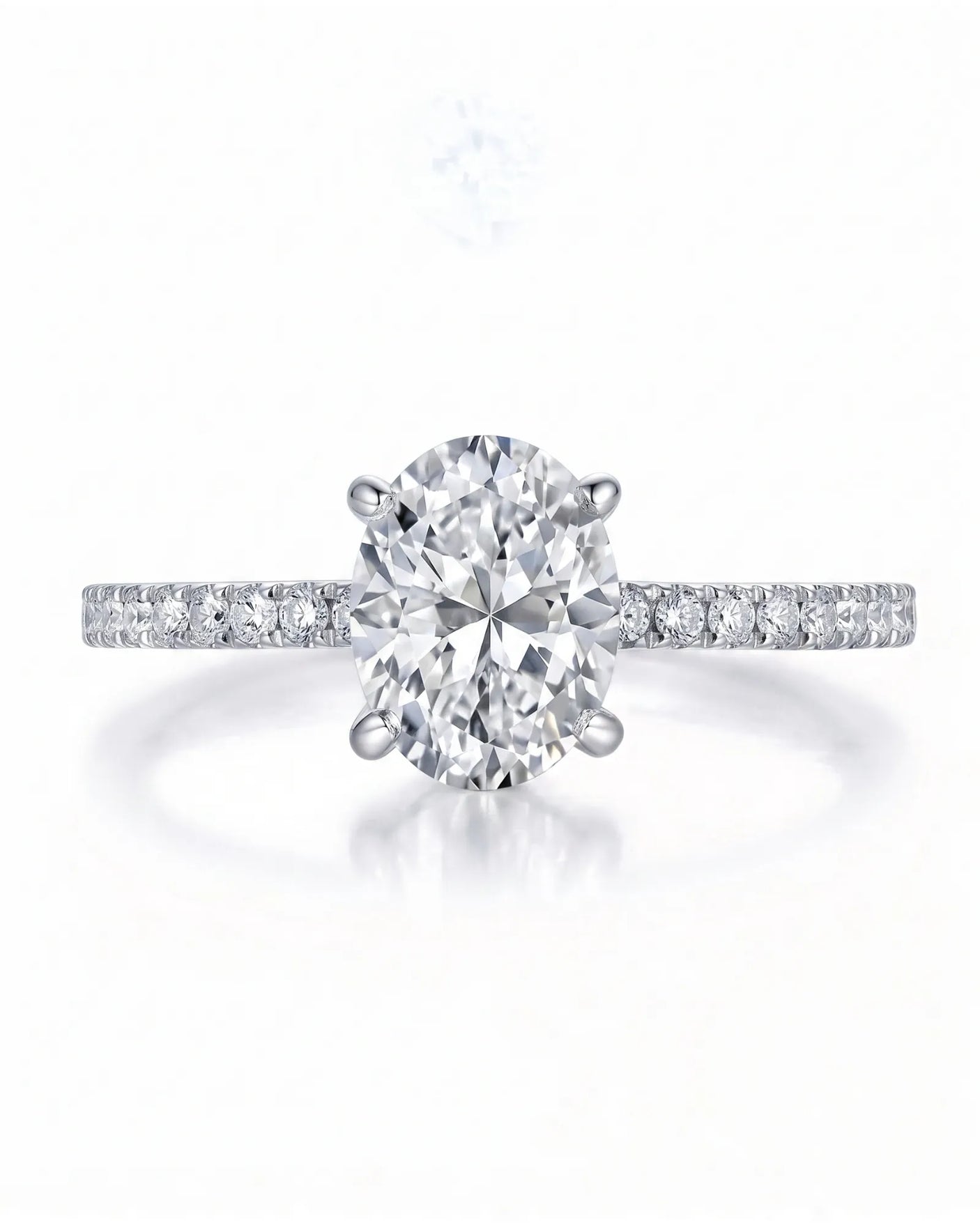 Adriana 1 carat F-colour oval natural diamond hidden halo ring in 18K white gold, front view of oval centre and pavé shoulders | SARATTI