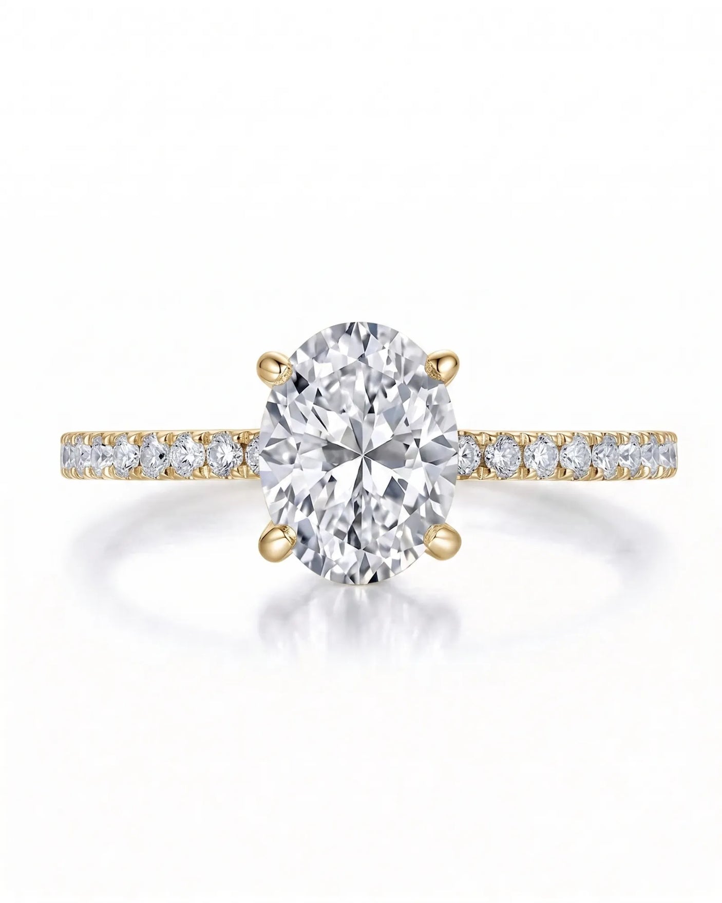 Adriana 1 carat F-colour oval natural diamond hidden halo ring in 18K yellow gold, front view of oval centre and pavé shoulders | SARATTI