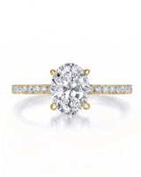 Adriana 1 carat F-colour oval natural diamond hidden halo ring in 18K yellow gold, front view of oval centre and pavé shoulders | SARATTI