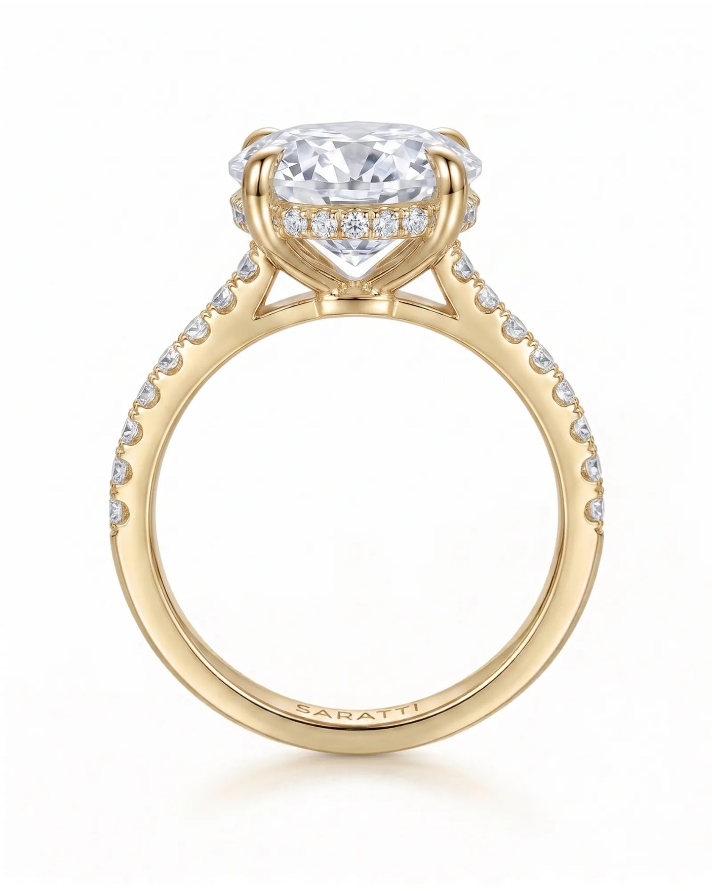 Adriana 1 carat F-colour oval natural diamond hidden halo ring in 18K yellow gold, side profile showing hidden halo and raised gallery | SARATTI