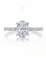 Adriana 1 carat F-colour oval natural diamond hidden halo ring in platinum, front view of oval centre and pavé shoulders | SARATTI