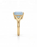AERIA emerald cut Aquamarine split-shank solitaire ring setting in Yellow Gold, side profile | SARATTI