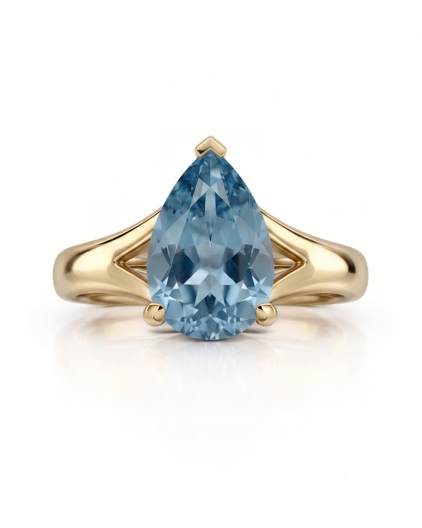 AERIA pear cut Aquamarine split shank solitaire ring setting in Yellow Gold, front view | SARATTI