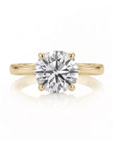 ARIA 1 carat round natural diamond solitaire engagement ring in 18K yellow gold, front view of four-prong setting | SARATTI