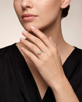 ARIA 1 carat round natural diamond solitaire engagement ring in 18K yellow gold, worn on hand | SARATTI