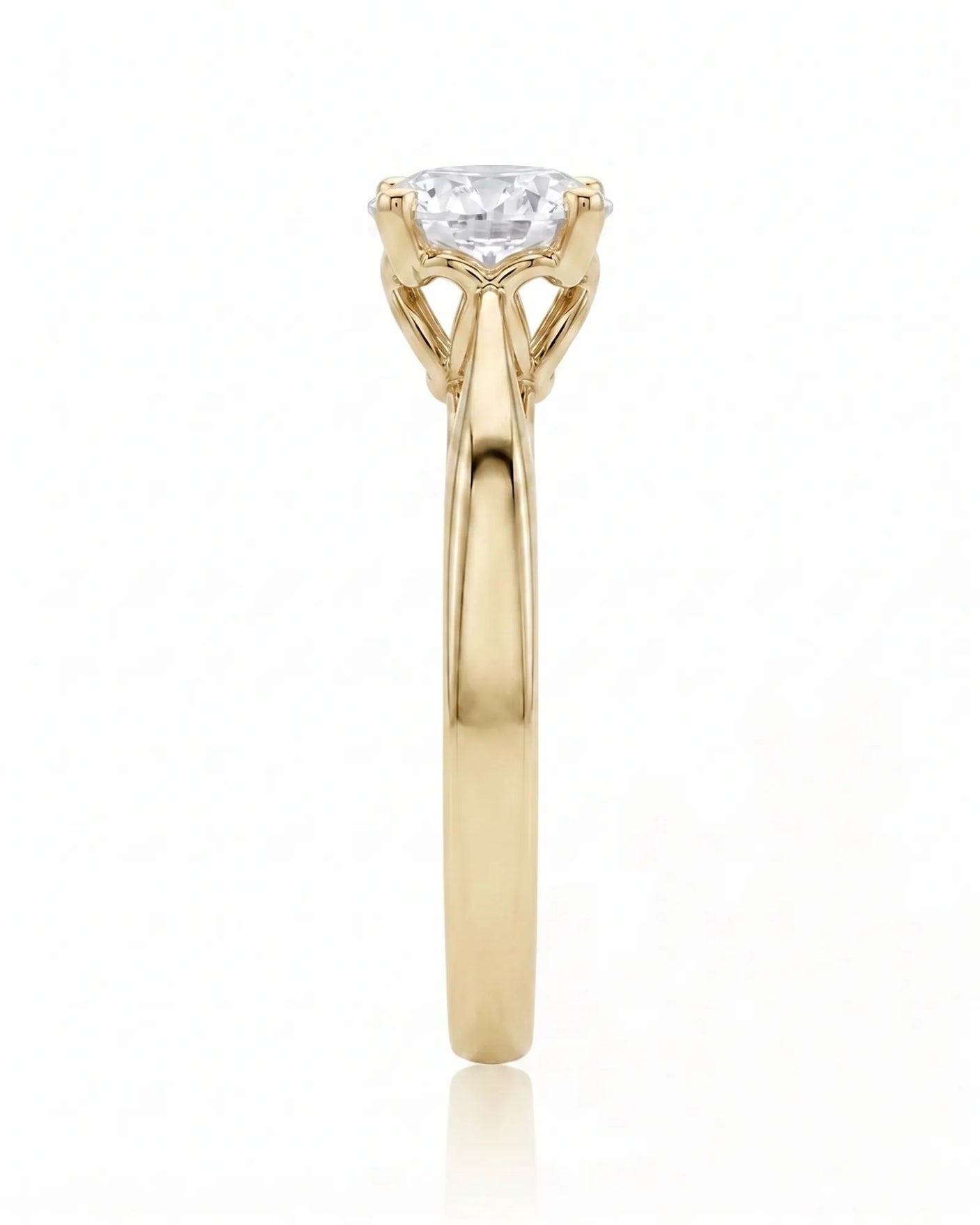 ARIA 1 carat round natural diamond solitaire engagement ring in 18K yellow gold, side profile showing elevated open basket | SARATTI