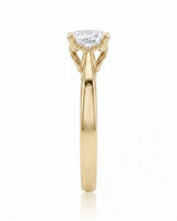 ARIA 1 carat round natural diamond solitaire engagement ring in 18K yellow gold, side profile showing elevated open basket | SARATTI