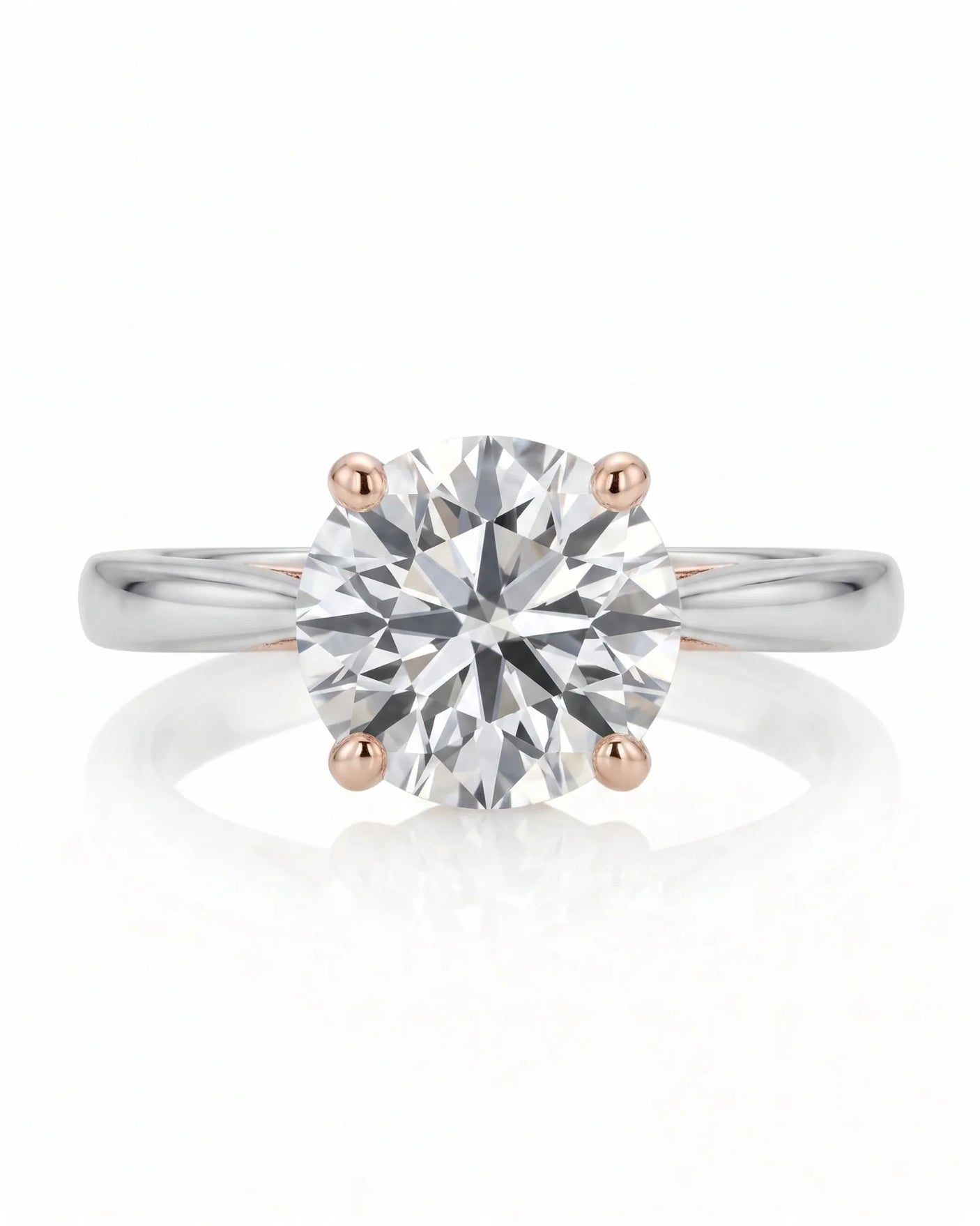 ARIA 1 carat round natural diamond two-tone solitaire engagement ring in 18K white and rose gold, front view of four-prong setting | SARATTI