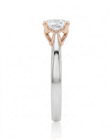 ARIA 1 carat round natural diamond two-tone solitaire engagement ring in 18K white and rose gold, side profile showing elevated open basket | SARATTI