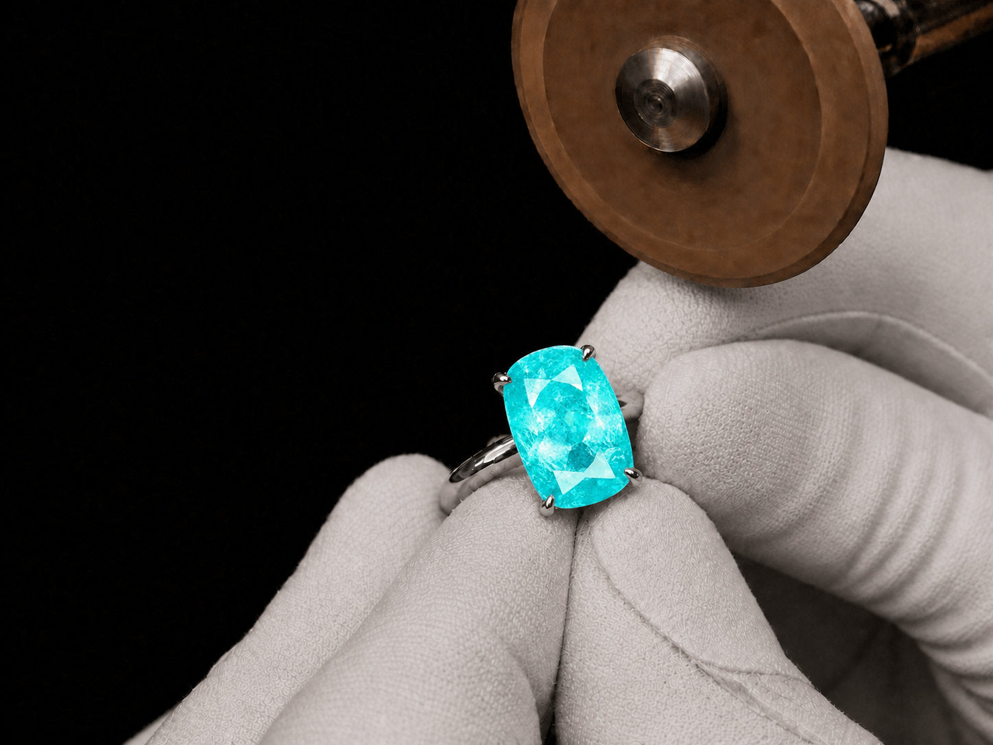 Neon blue-green Paraiba tourmaline ring, metal kept back so light reaches the pavilion | SARATTI