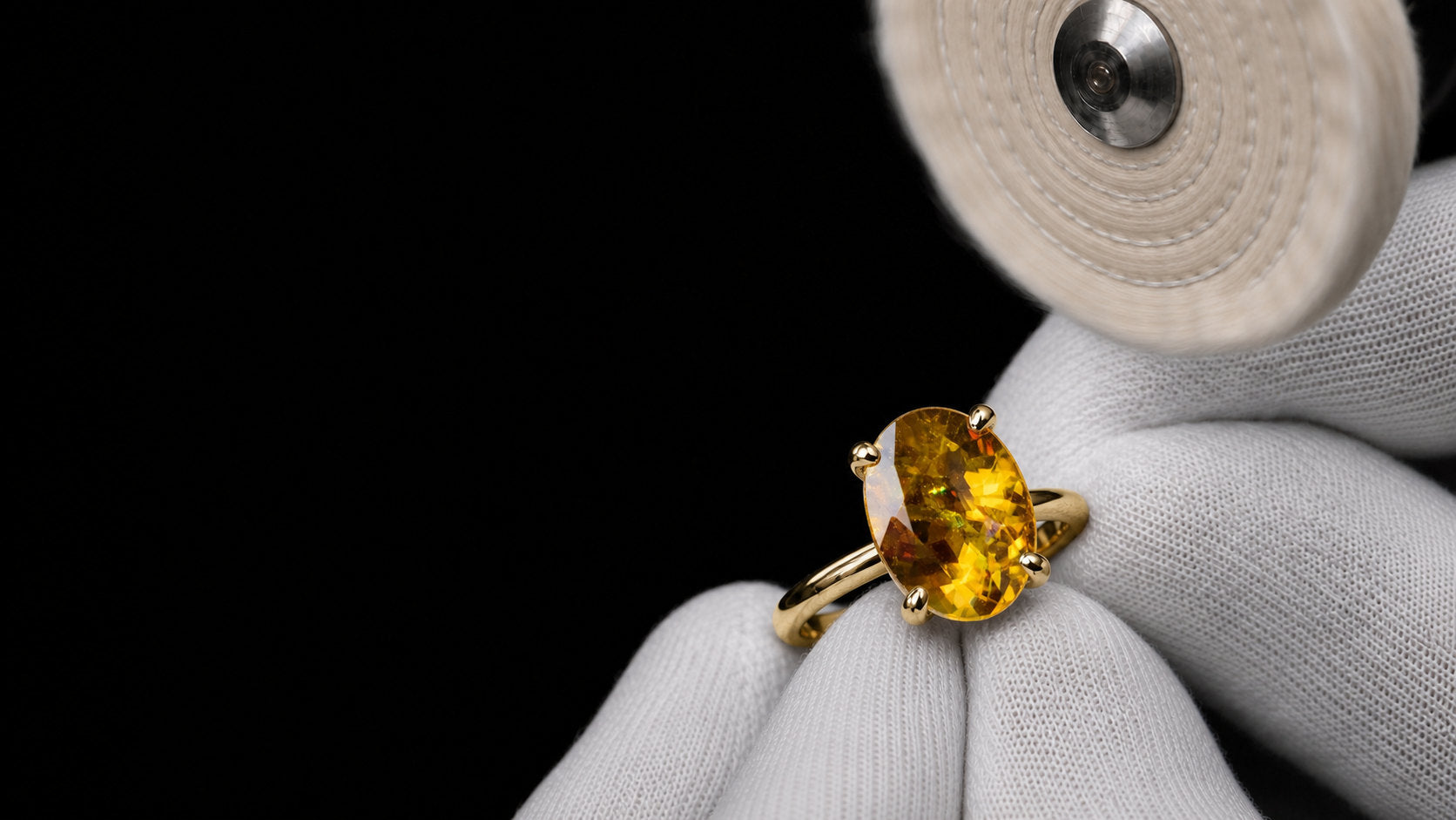 Sphene ring showing dispersion higher than diamond, set last and held lightly | SARATTI