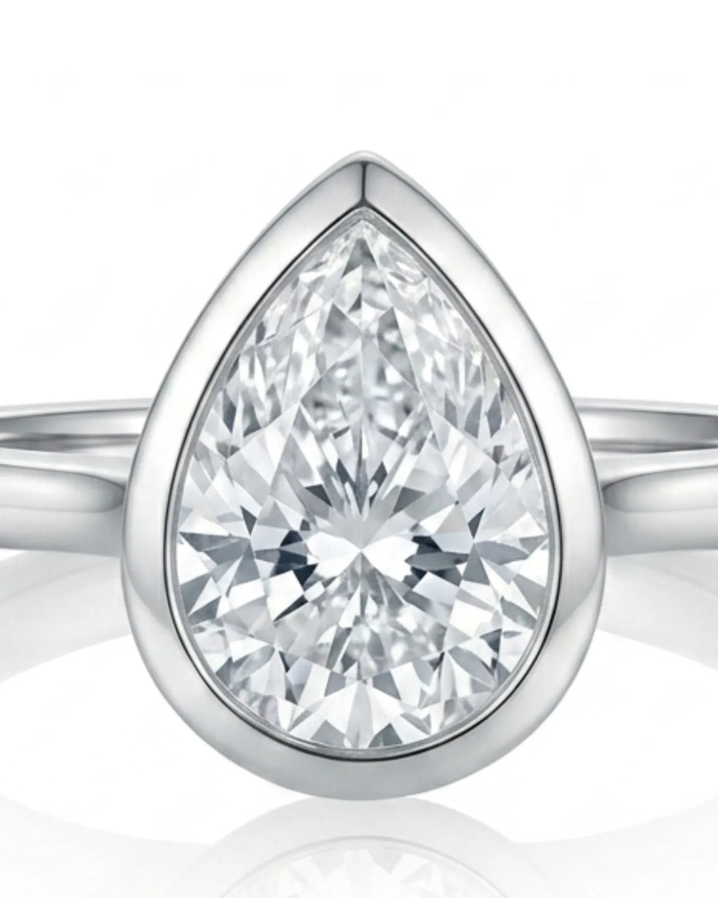 Aurelia's Embrace pear-cut natural diamond bezel engagement ring in 18K white gold, close-up of diamond and bezel setting | SARATTI