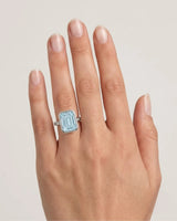 AUREX emerald cut Aquamarine bezel ring setting in Platinum, shown on hand | SARATTI