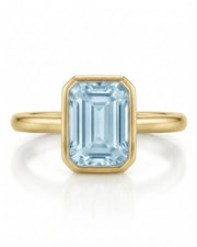 AUREX emerald cut Aquamarine bezel ring setting in Yellow Gold, front view | SARATTI