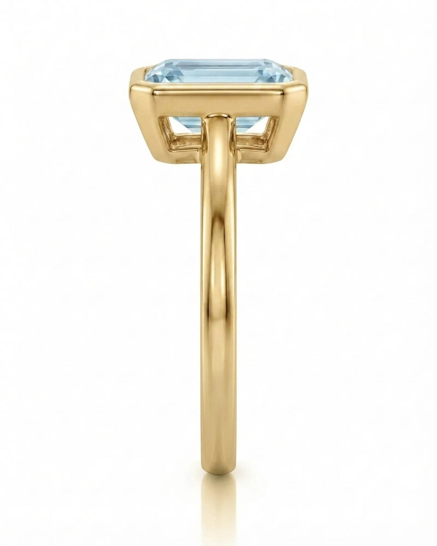 AUREX emerald cut Aquamarine bezel ring setting in Yellow Gold, side profile | SARATTI
