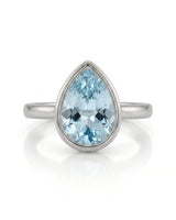 AUREX pear cut Aquamarine bezel solitaire ring setting in White Gold, front view | SARATTI