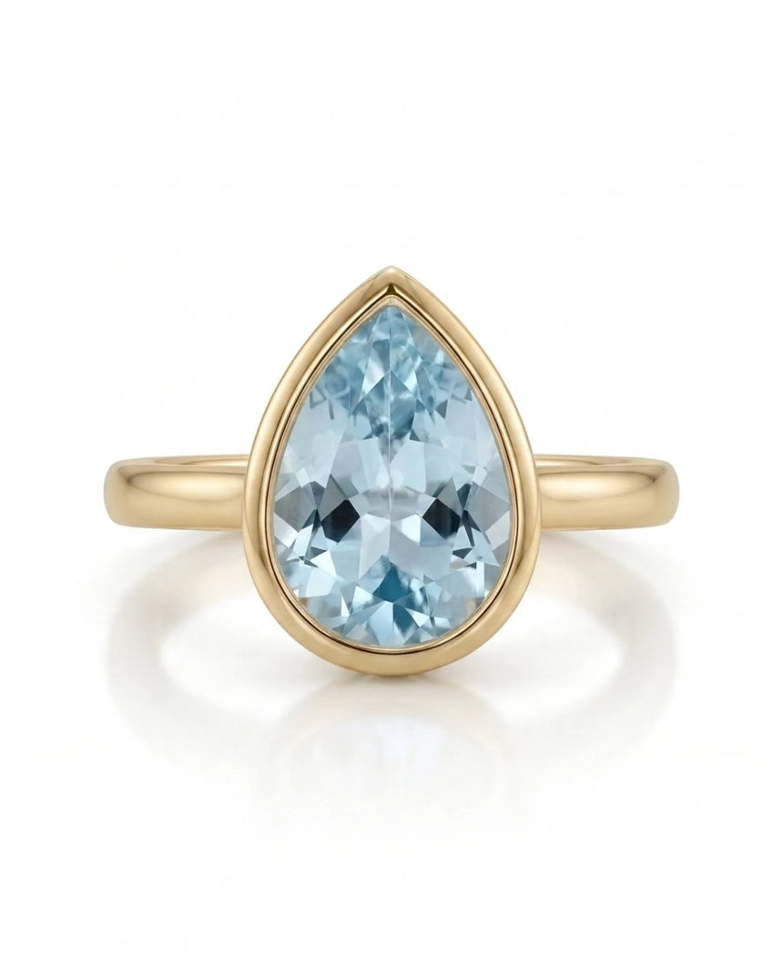 AUREX pear cut Aquamarine bezel solitaire ring setting in Yellow Gold, front view | SARATTI