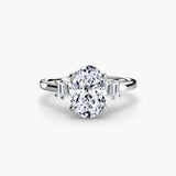 AVENIR oval cut tapered baguette solitaire ring setting in platinum | SARATTI