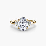 AVENIR oval cut tapered baguette solitaire ring setting in yellow gold | SARATTI