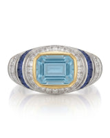 Azzurro Regent emerald-cut Aquamarine cocktail ring setting in yellow and white gold, front view with baguette diamond frame and blue sapphire channels | SARATTI