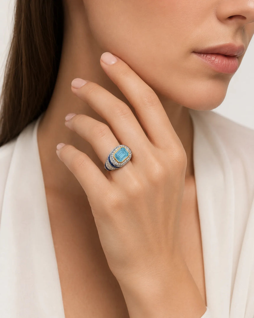 Azzurro Regent emerald-cut Aquamarine sapphire and diamond cocktail ring setting in yellow and white gold, worn on hand | SARATTI