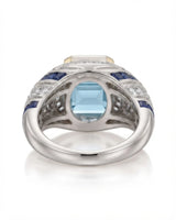 Azzurro Regent emerald-cut Aquamarine cocktail ring setting in yellow and white gold, underside showing open geometric gallery and broad shank | SARATTI