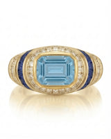 Azzurro Regent emerald-cut Aquamarine cocktail ring setting in yellow gold, front view with baguette diamond frame and blue sapphire channels | SARATTI