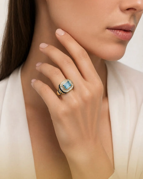 Azzurro Regent emerald-cut Aquamarine sapphire and diamond cocktail ring setting in yellow gold, worn on hand | SARATTI