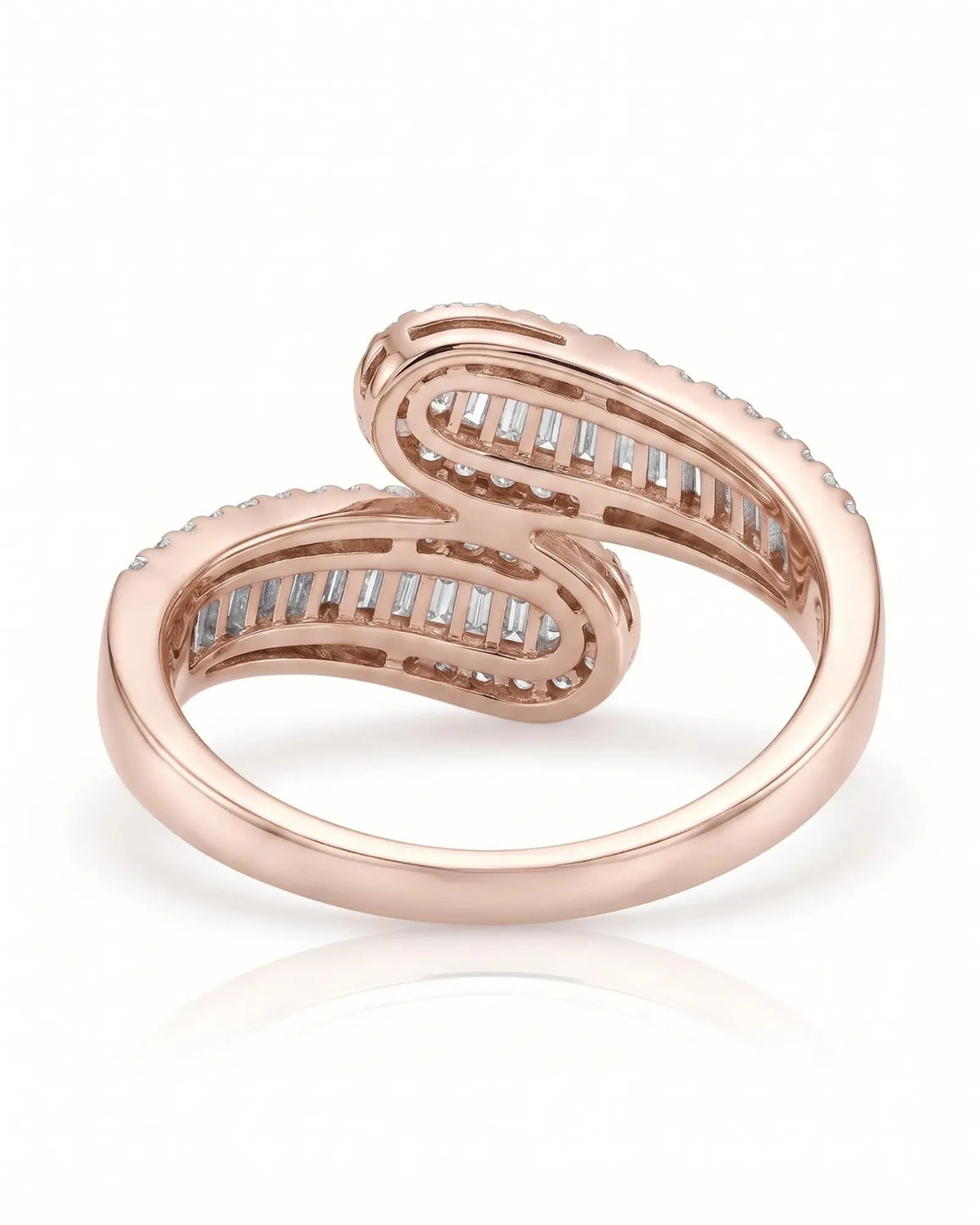 Baguette and round diamond band in 18K rose gold showing the sculptural curved setting | SARATTI