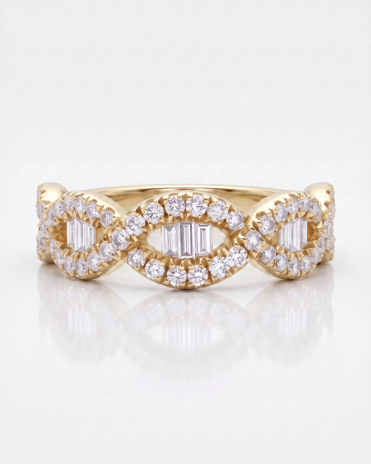 Yellow gold baguette and round diamond wedding band showing the flowing half eternity design | SARATTI