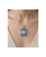 Bleu Meridian emerald-cut Aquamarine sapphire and diamond necklace setting in rose gold, worn at the neckline | SARATTI
