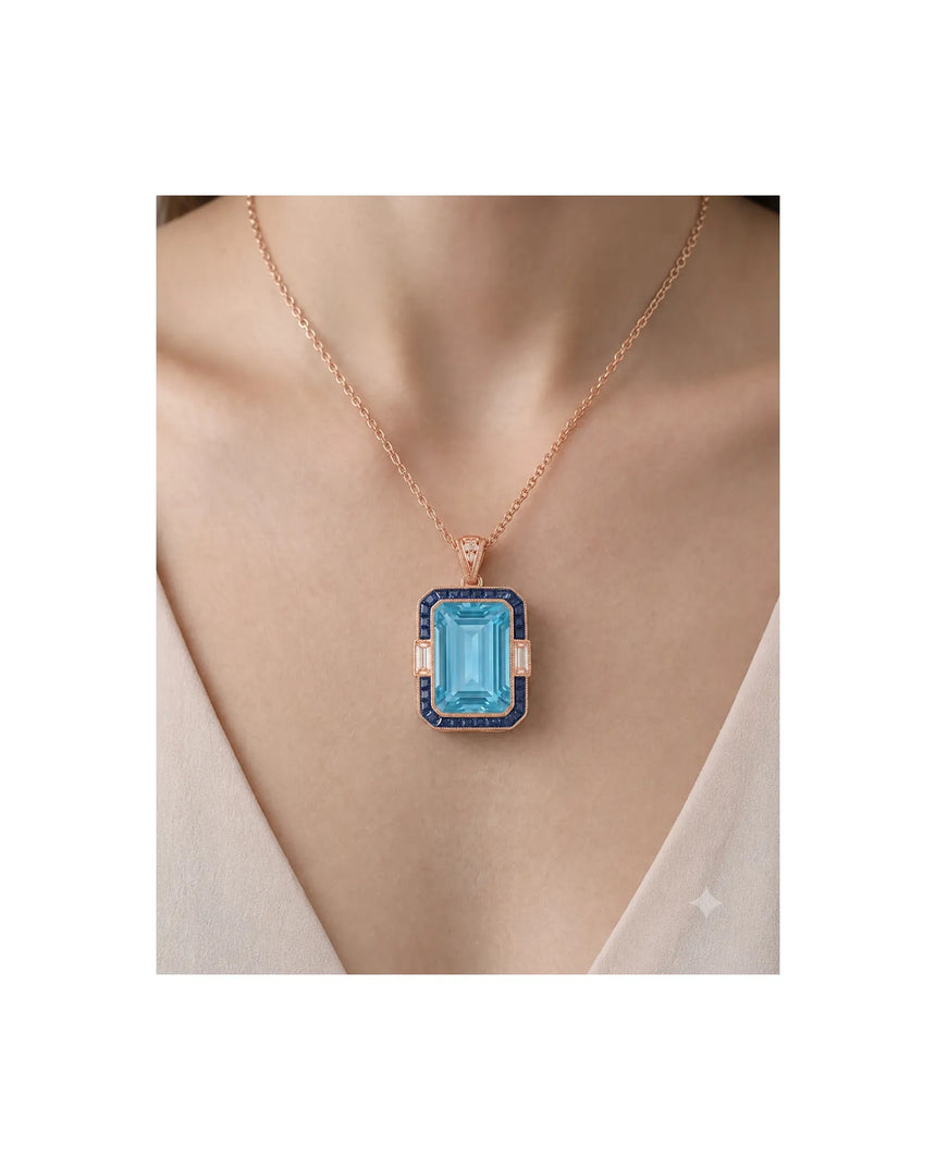 Bleu Meridian emerald-cut Aquamarine sapphire and diamond necklace setting in rose gold, worn at the neckline | SARATTI