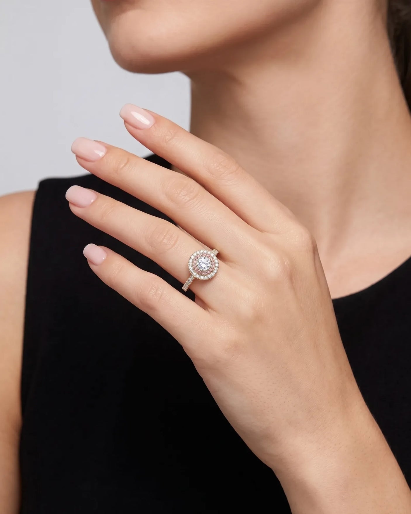 Chelsea 0.5 carat round natural diamond engagement ring with natural pink diamond double halo in 18K yellow gold, worn on hand | SARATTI