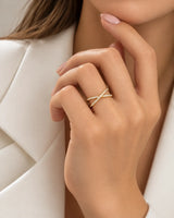 Beauty portrait of the criss cross diamond wedding band in 18K yellow gold with round brilliant diamonds | SARATTI