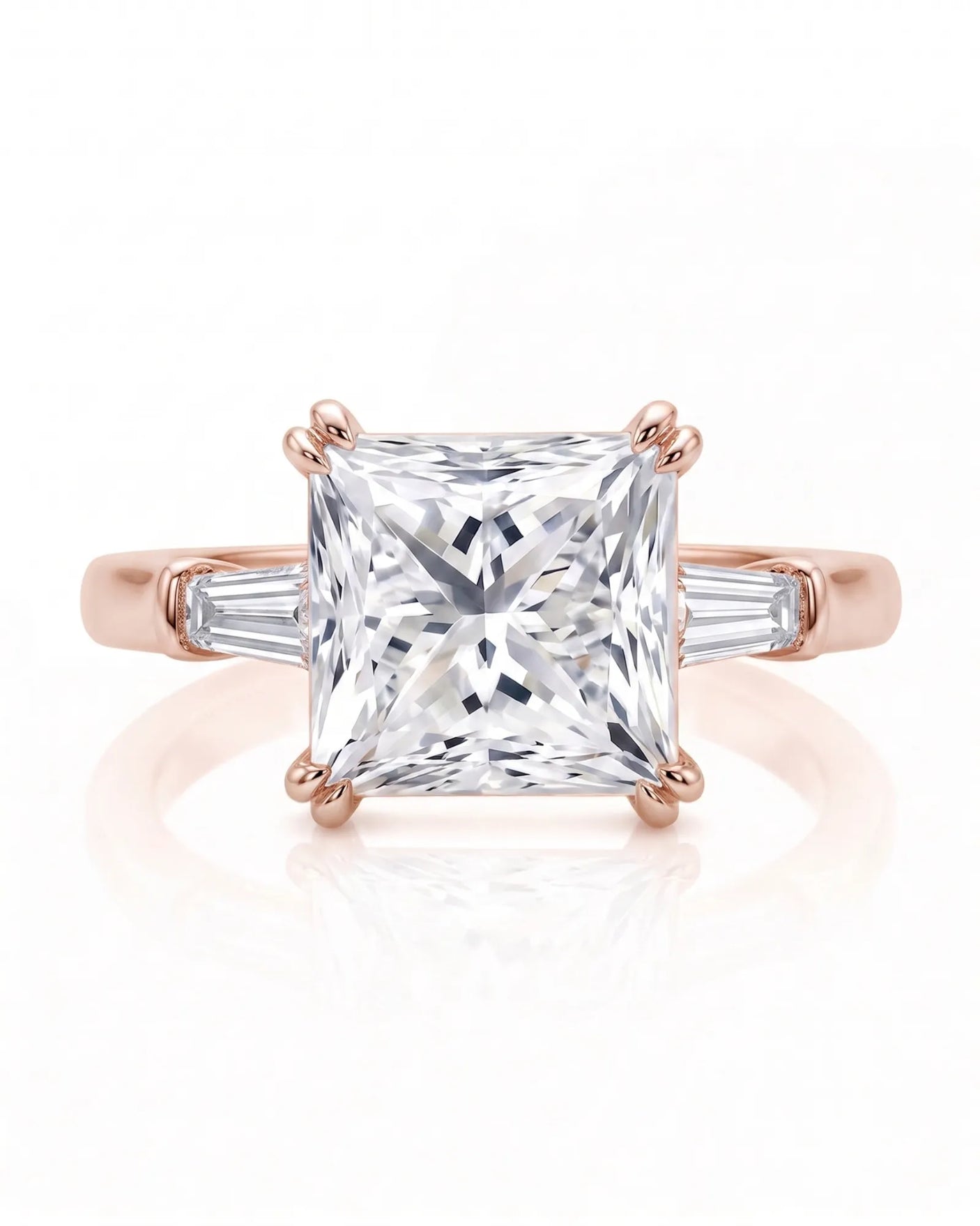 Diane 1 carat F-colour princess natural diamond three-stone ring in 18K rose gold, front view of princess centre and tapered side diamonds | SARATTI