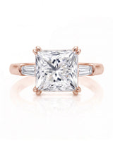 Diane 1 carat F-colour princess natural diamond three-stone ring in 18K rose gold, front view of princess centre and tapered side diamonds | SARATTI