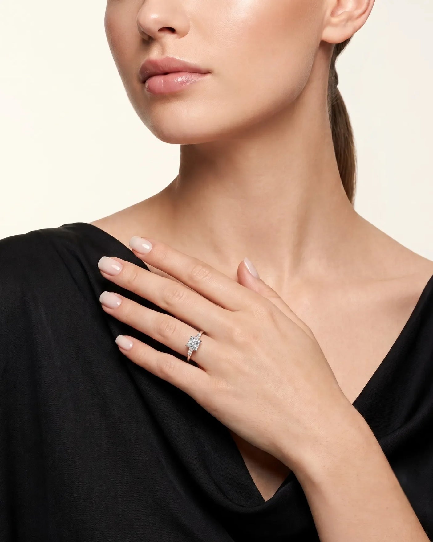 Diane 1 carat F-colour princess natural diamond three-stone ring in 18K rose gold, worn on hand | SARATTI