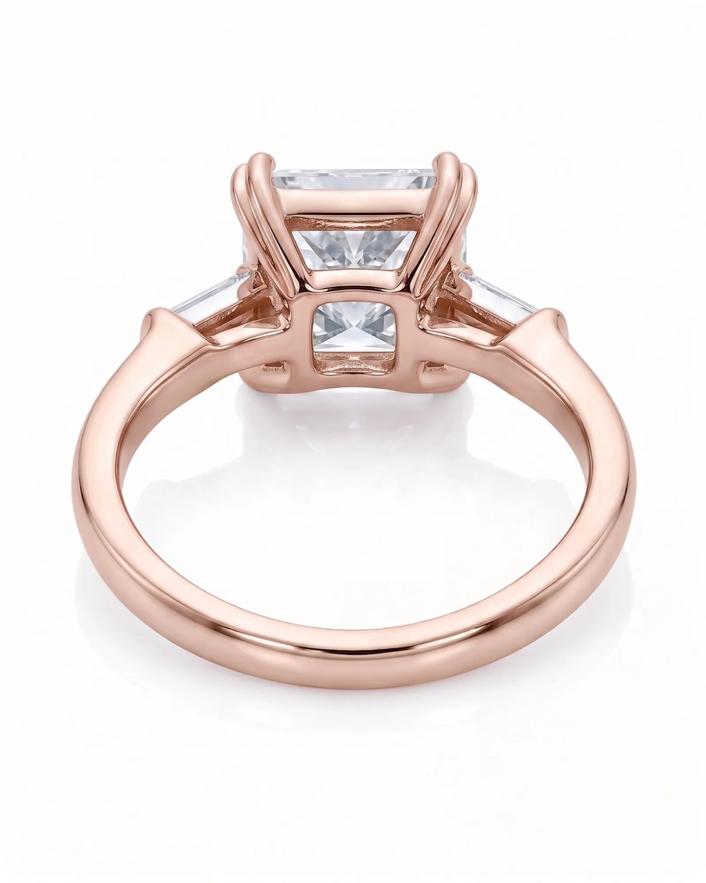 Diane 1 carat F-colour princess natural diamond three-stone ring in 18K rose gold, underside view of three-stone setting | SARATTI