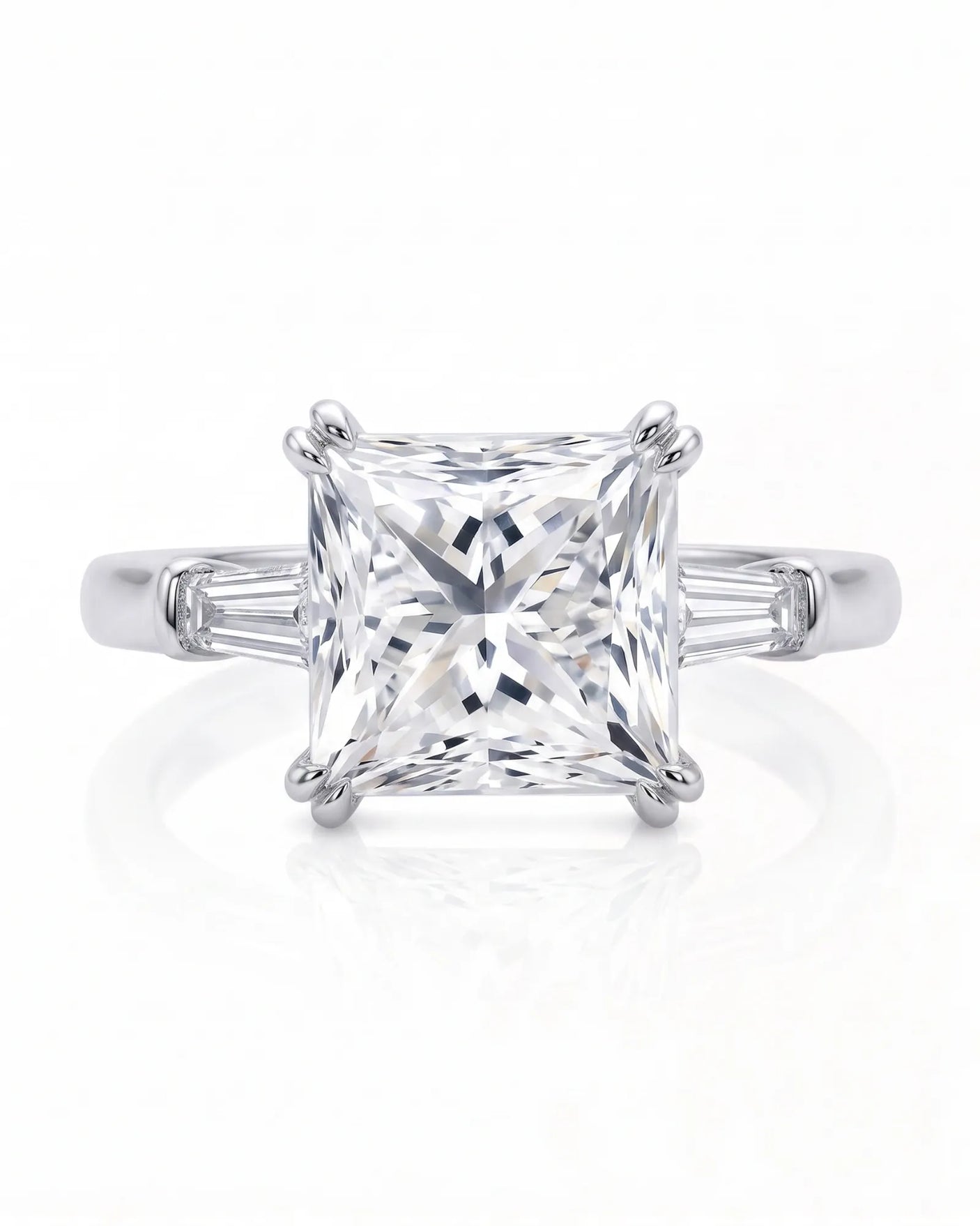 Diane 1 carat F-colour princess natural diamond three-stone ring in 18K white gold, front view of princess centre and tapered side diamonds | SARATTI