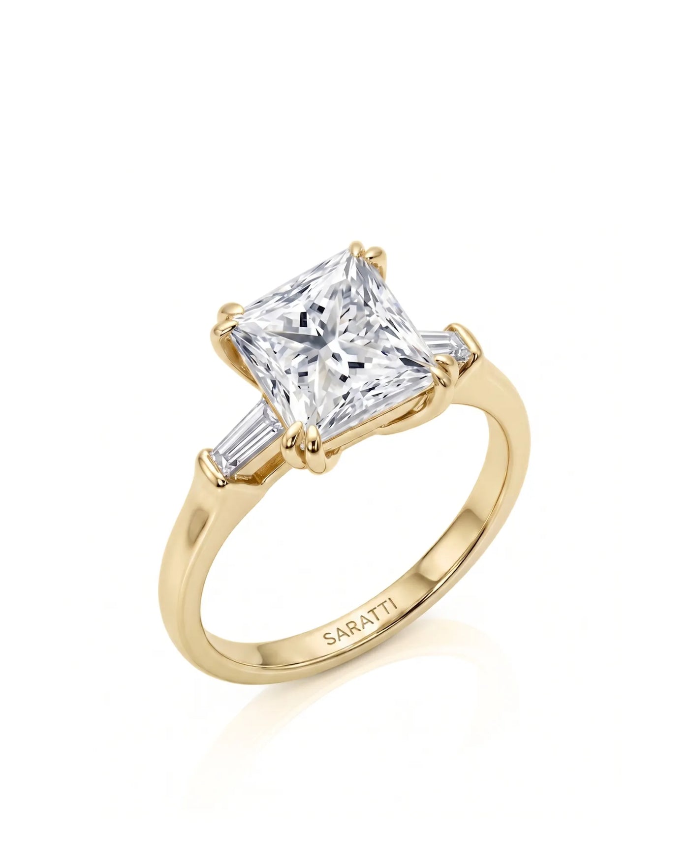 Diane 1 carat F-colour princess natural diamond three-stone ring in 18K yellow gold, 45-degree hero view | SARATTI