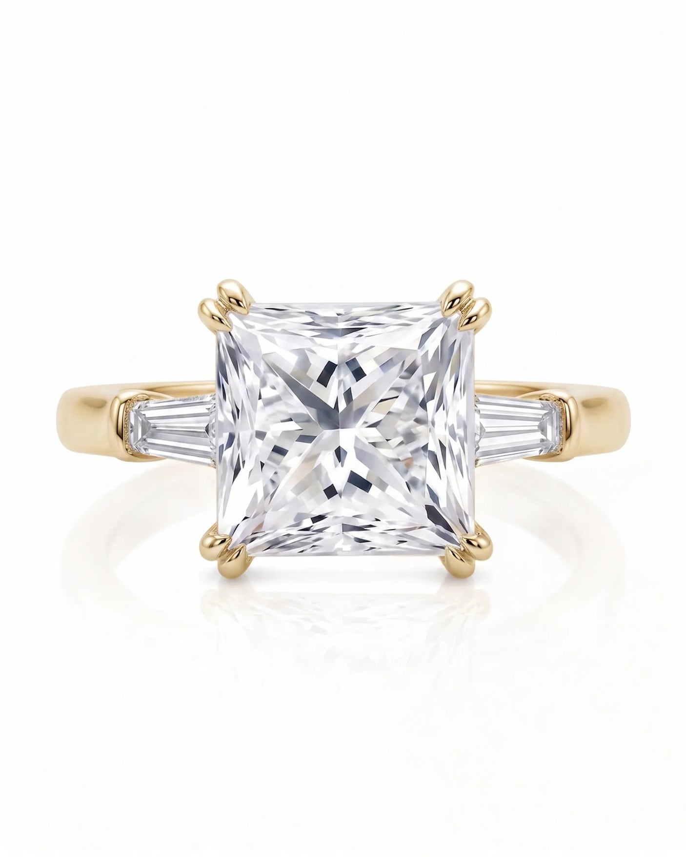 Diane 1 carat F-colour princess natural diamond three-stone ring in 18K yellow gold, front view of princess centre and tapered side diamonds | SARATTI