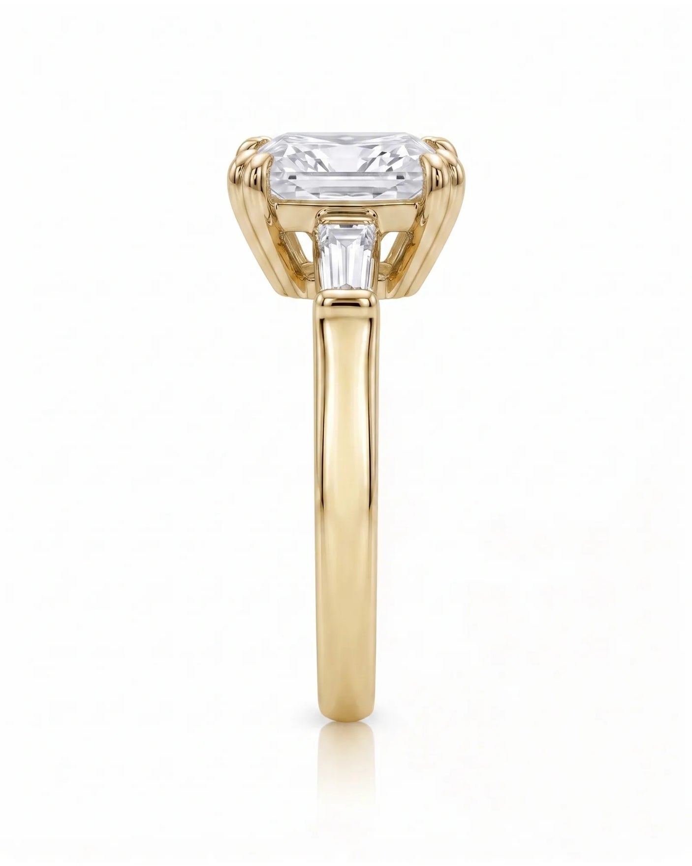 Diane 1 carat F-colour princess natural diamond three-stone ring in 18K yellow gold, side profile showing raised open three-stone gallery | SARATTI
