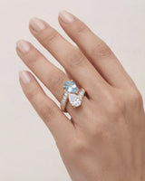 Élan Céleste pear-cut Aquamarine and diamond bypass ring setting in rose gold, worn on hand | SARATTI