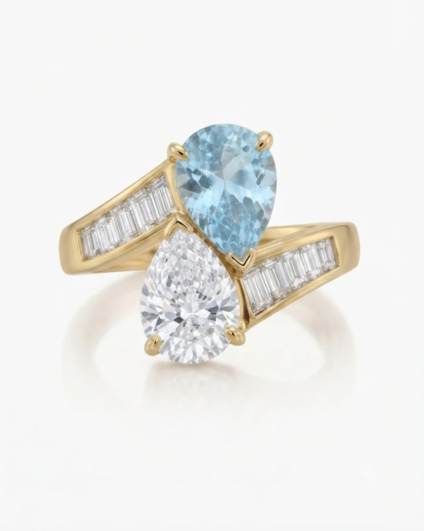 Élan Céleste pear-cut Aquamarine and pear diamond bypass ring setting in yellow gold, front view | SARATTI