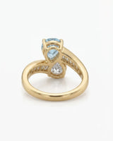 Élan Céleste pear-cut Aquamarine bypass ring setting in yellow gold, underside showing curved crossover band and open gallery | SARATTI
