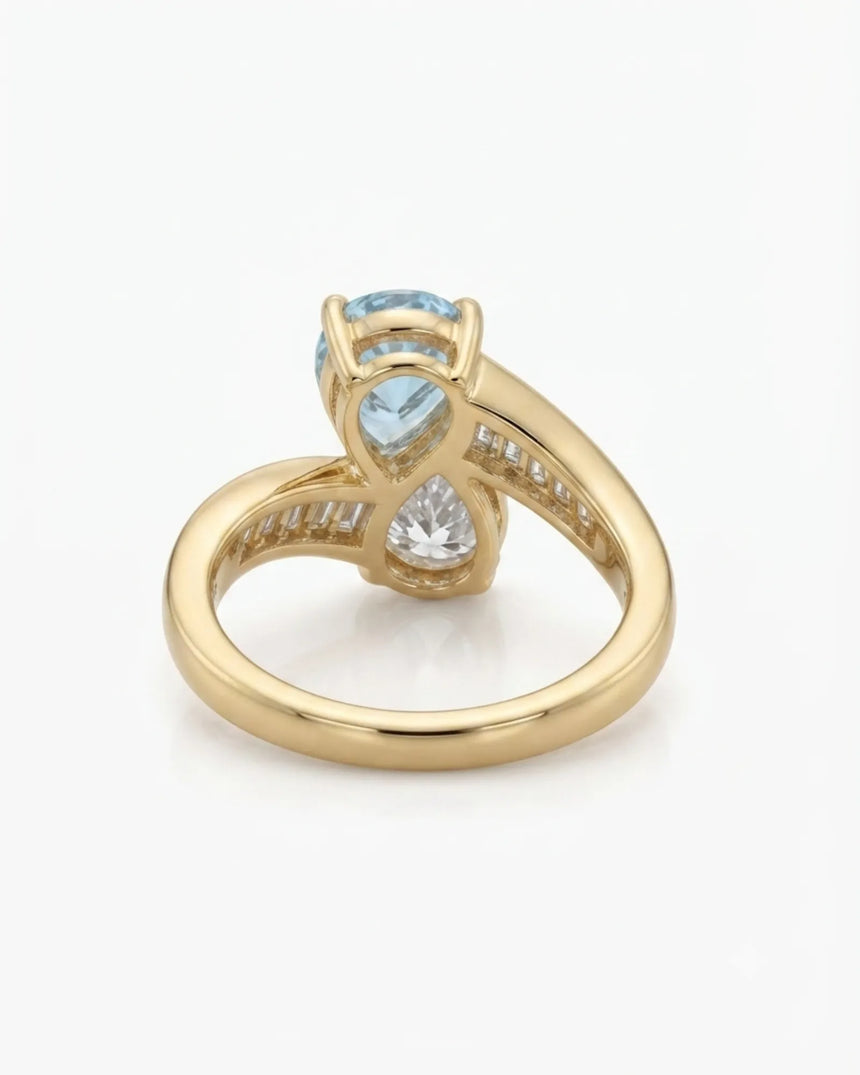Élan Céleste pear-cut Aquamarine bypass ring setting in yellow gold, underside showing curved crossover band and open gallery | SARATTI